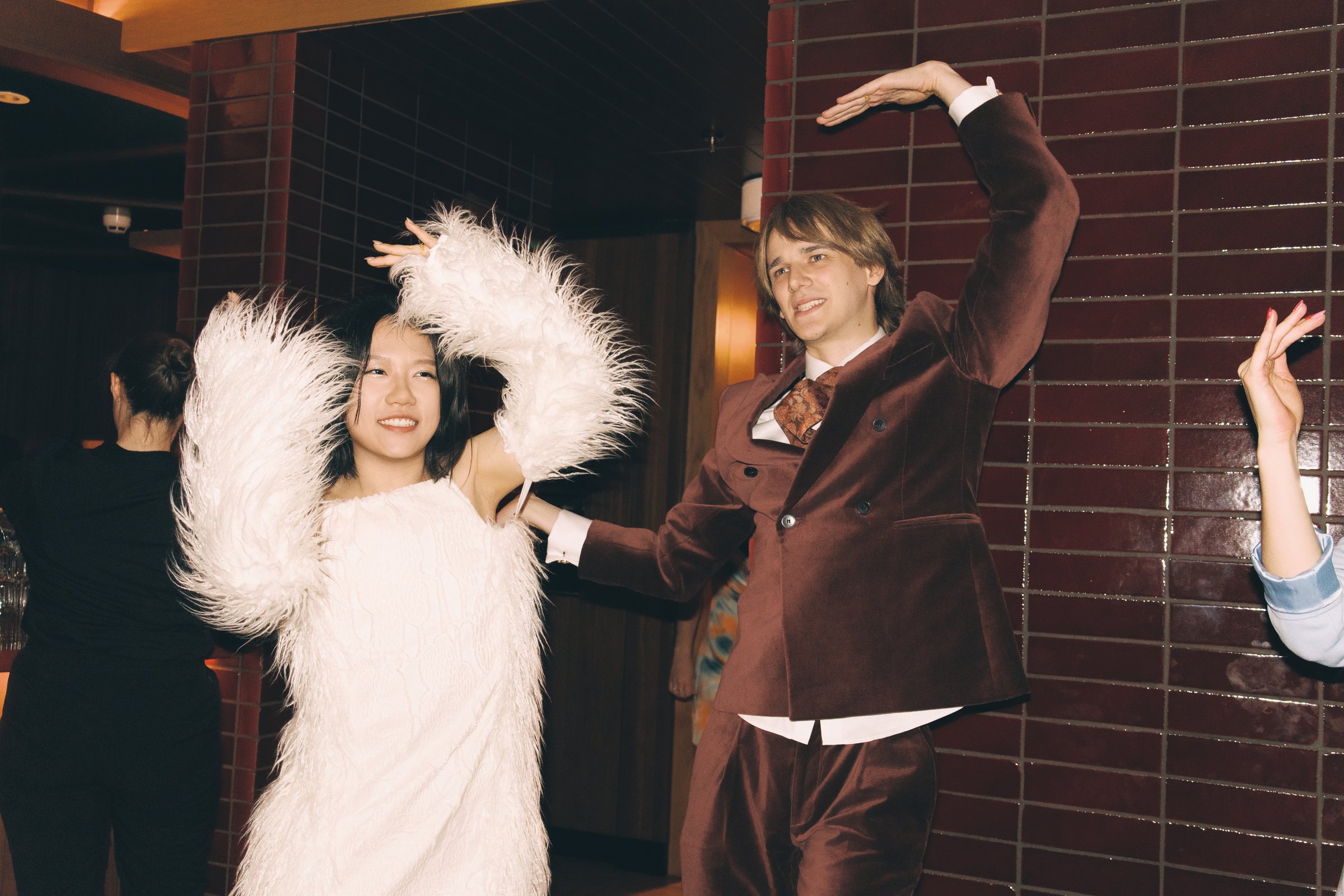 A newly married couple dancing together at their reception