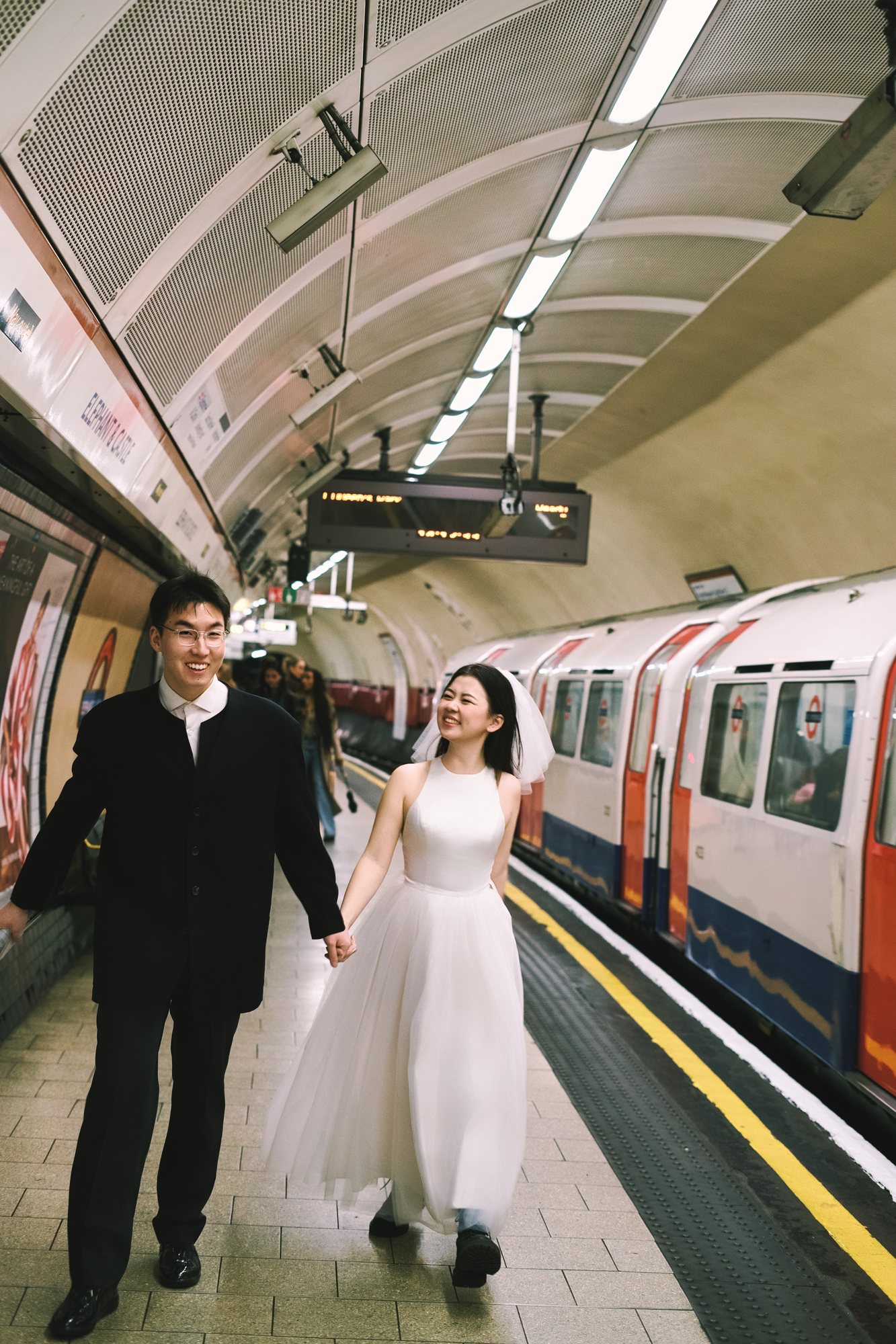 A couple walking together on an Underground platform